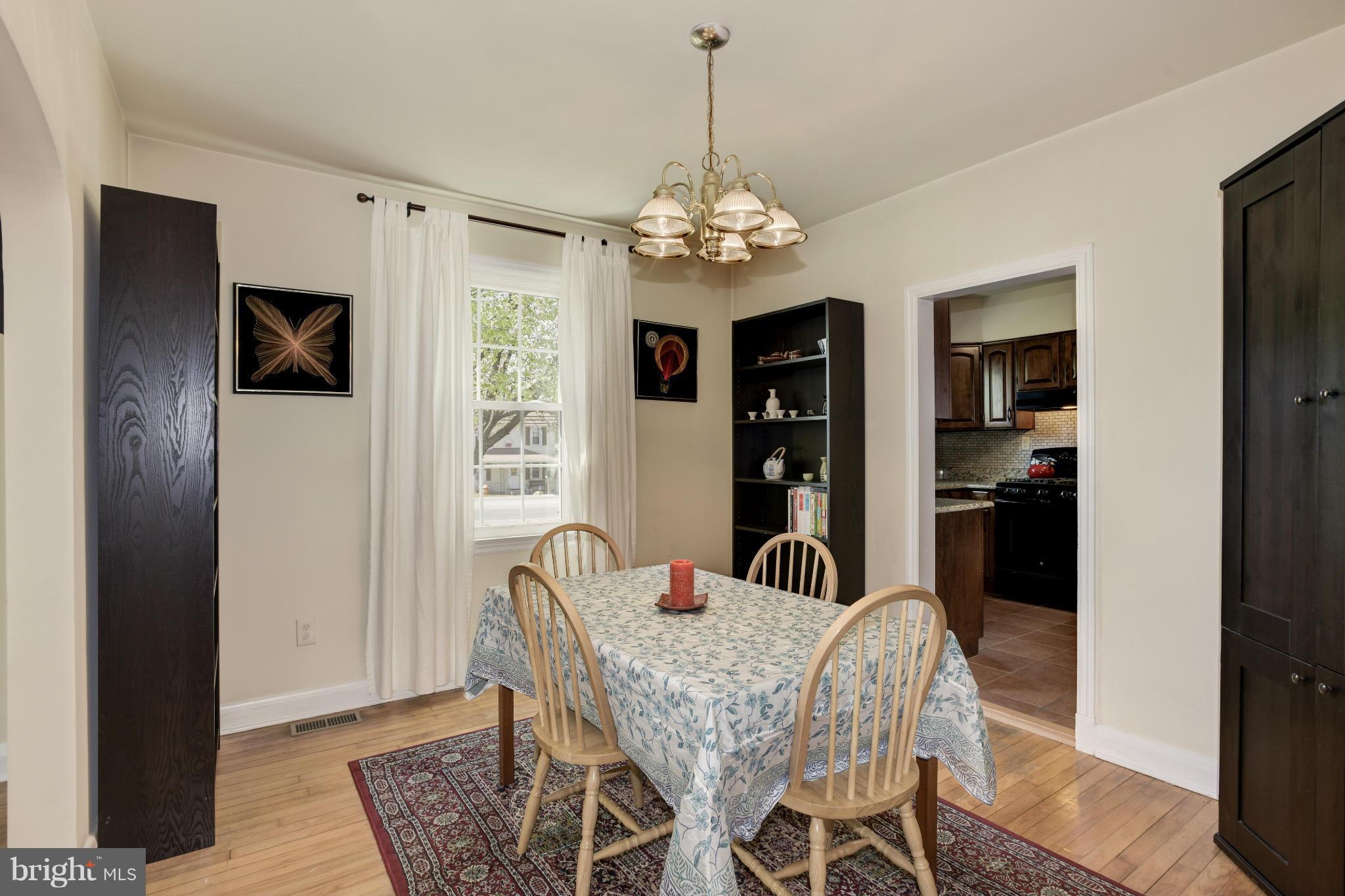 5521 Waterloo Road Ellicott City, MD 21043 - Photo 9 of 30 a view of a dining room with furniture window and wooden floor