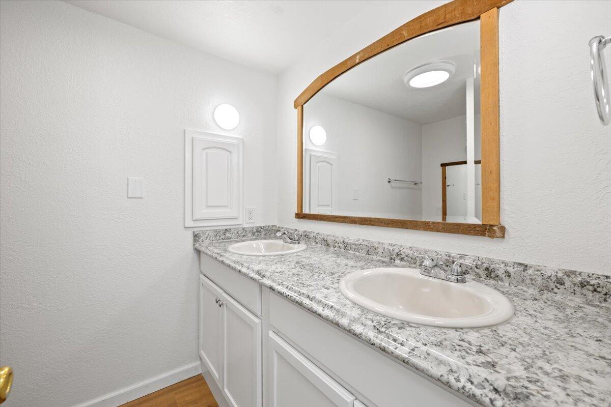939 South Valley View Road, Unit 12 Ashland, OR 97520 - Photo 14 of 19 a bathroom with a sink and a mirror