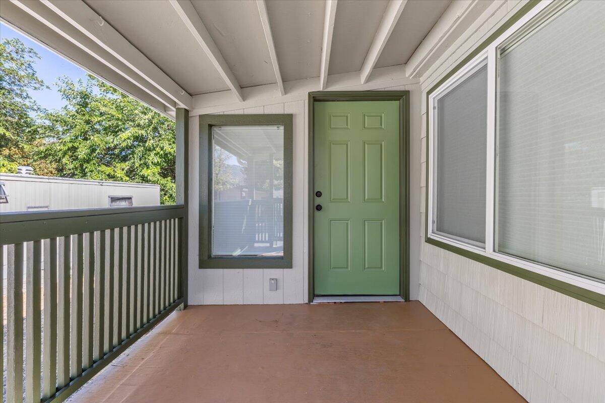 939 South Valley View Road, Unit 12 Ashland, OR 97520 - Photo 16 of 19 a view of a porch with wooden floor and outdoor space