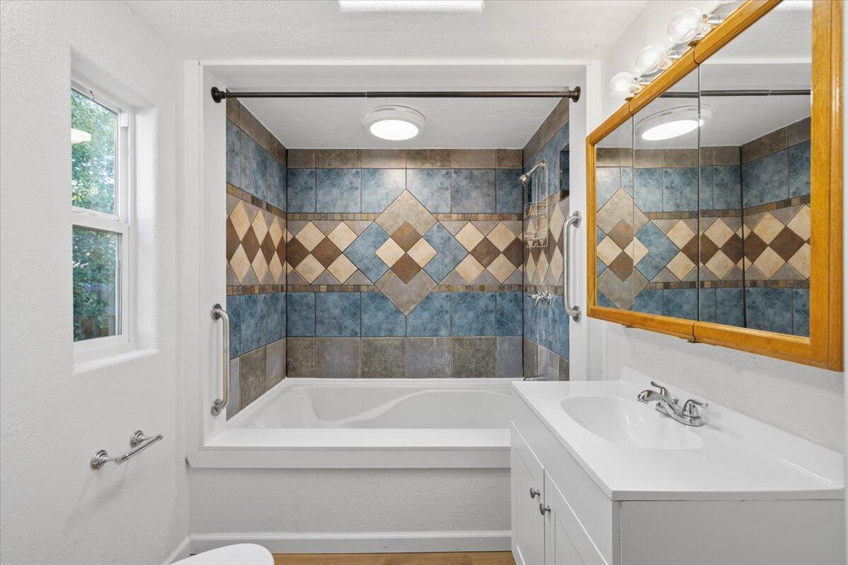 939 South Valley View Road, Unit 12 Ashland, OR 97520 - Photo 10 of 19 a bathroom with a sink and a bathtub