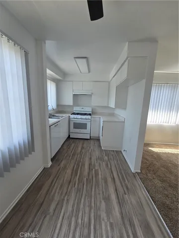 a bathroom with a sink toilet and a mirror