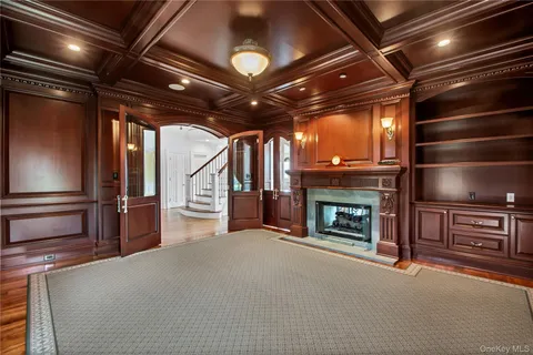 a view of an empty room with fire place