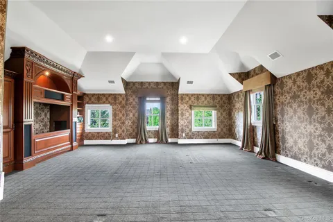 a view of a room with window and fireplace
