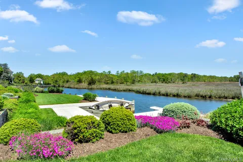 a view of a lake with houses in the back