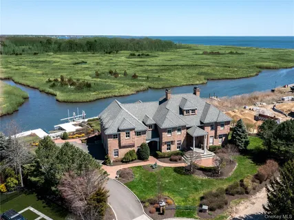a view of a lake with a garden and houses