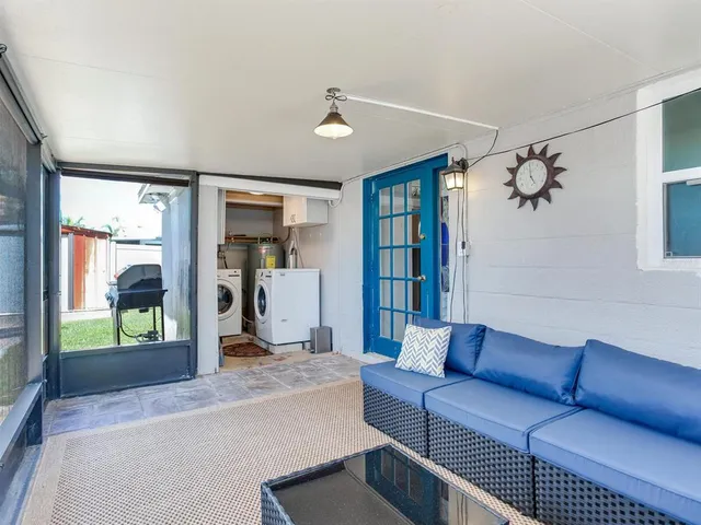 a view of a backyard with sitting area