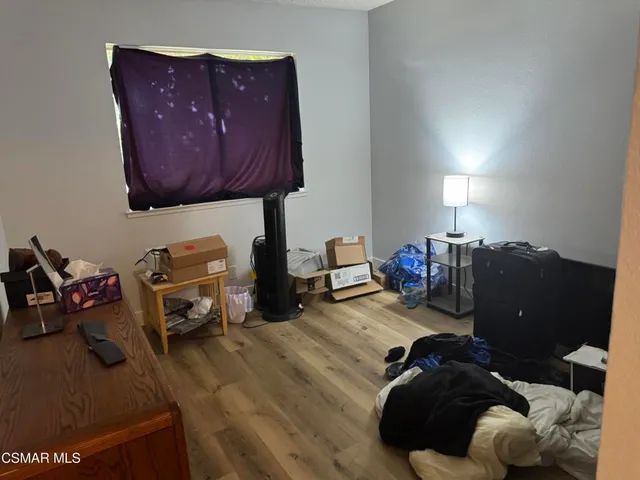 a room with furniture and wooden floor