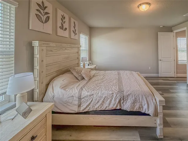 a bathroom with a double vanity sink mirror and shower