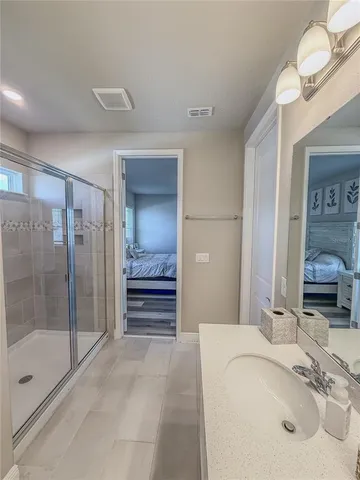 a bedroom with a bed and a tv