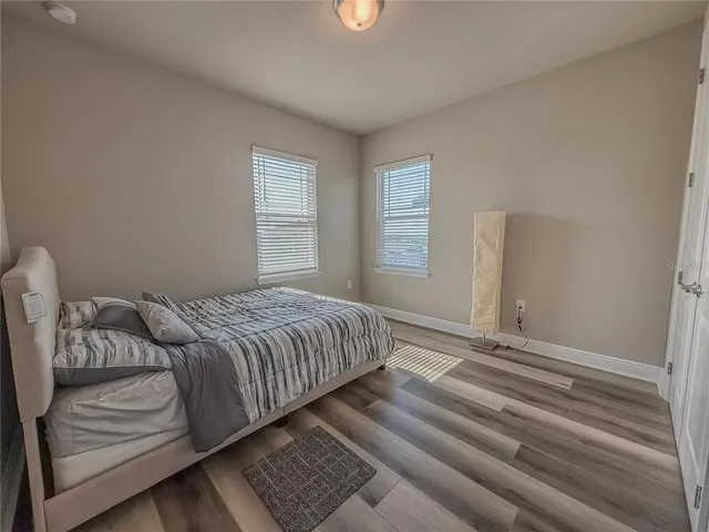 a bedroom with a bed and gym equipment