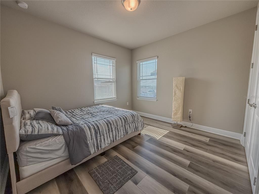 2310 Raven Rdg Drive Minneola, FL 34715 - Photo 17 of 21 a bedroom with a bed and a window