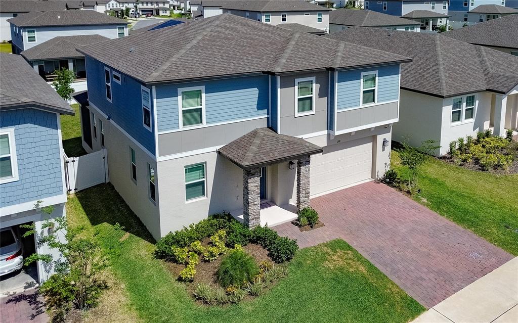 2310 Raven Rdg Drive Minneola, FL 34715 - Photo 2 of 21 front view of a house with a yard