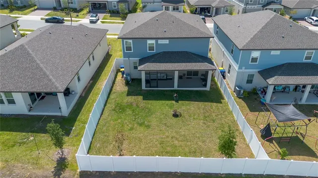 a aerial view of a house with swimming pool