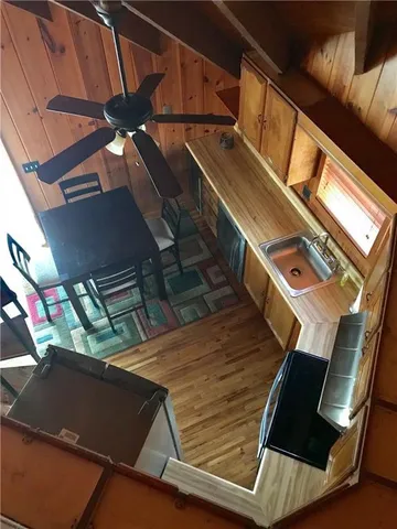 a view of living room with furniture and wooden floor