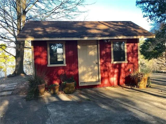 a view of a house with a tree