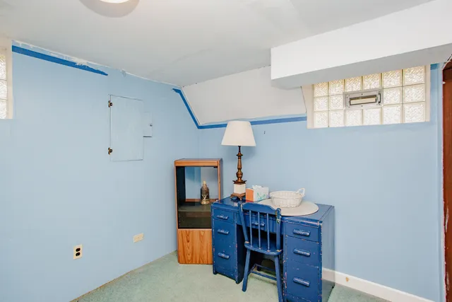 a bathroom with a sink toilet and mirror