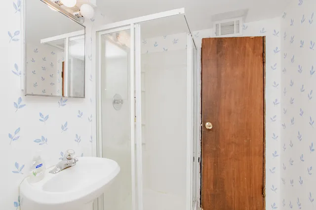 a view of storage and utility room with washer and dryer