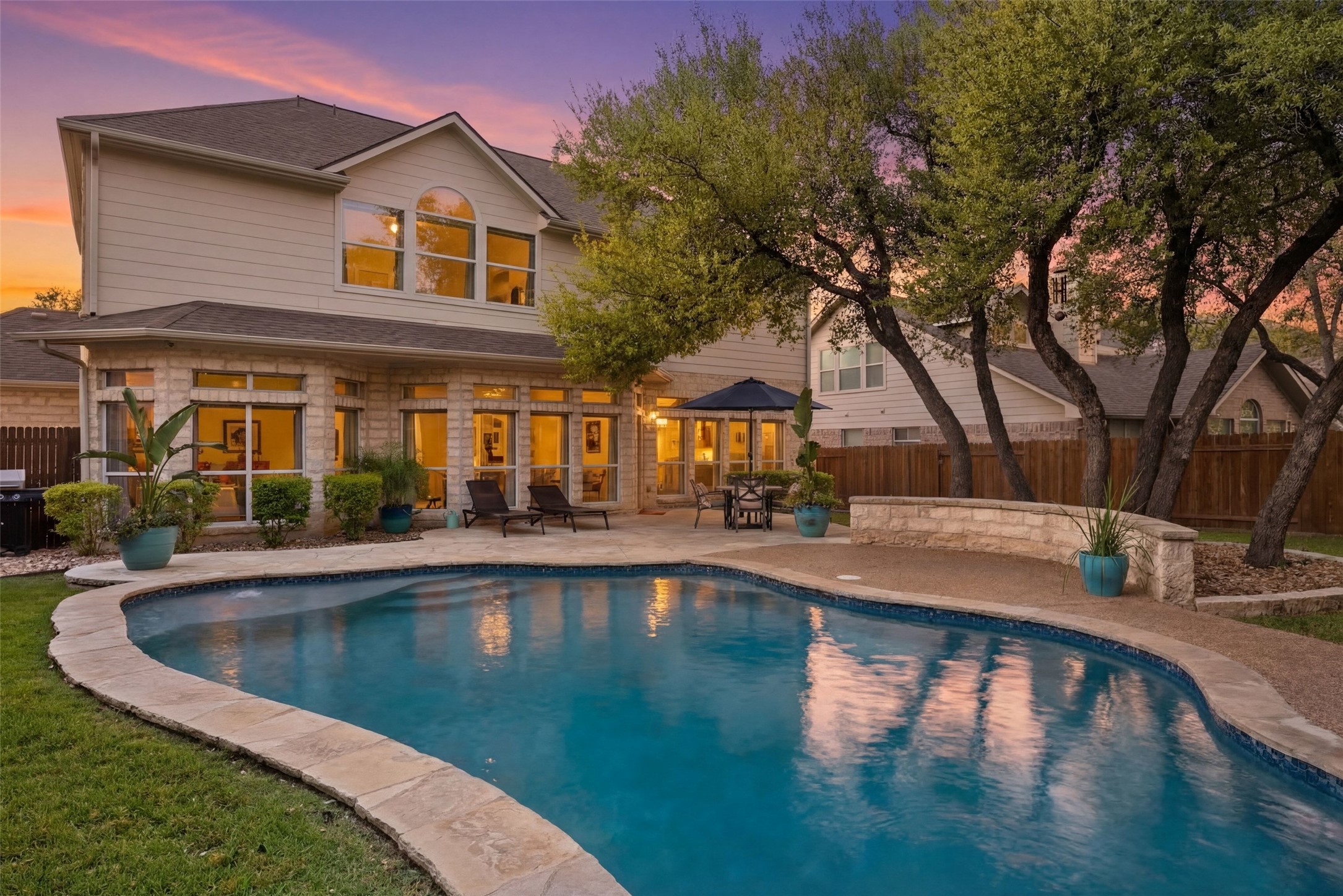 12510 Bright Sky Overlook Austin, TX 78732 - Photo 1 of 39 a swimming pool with outdoor seating and yard