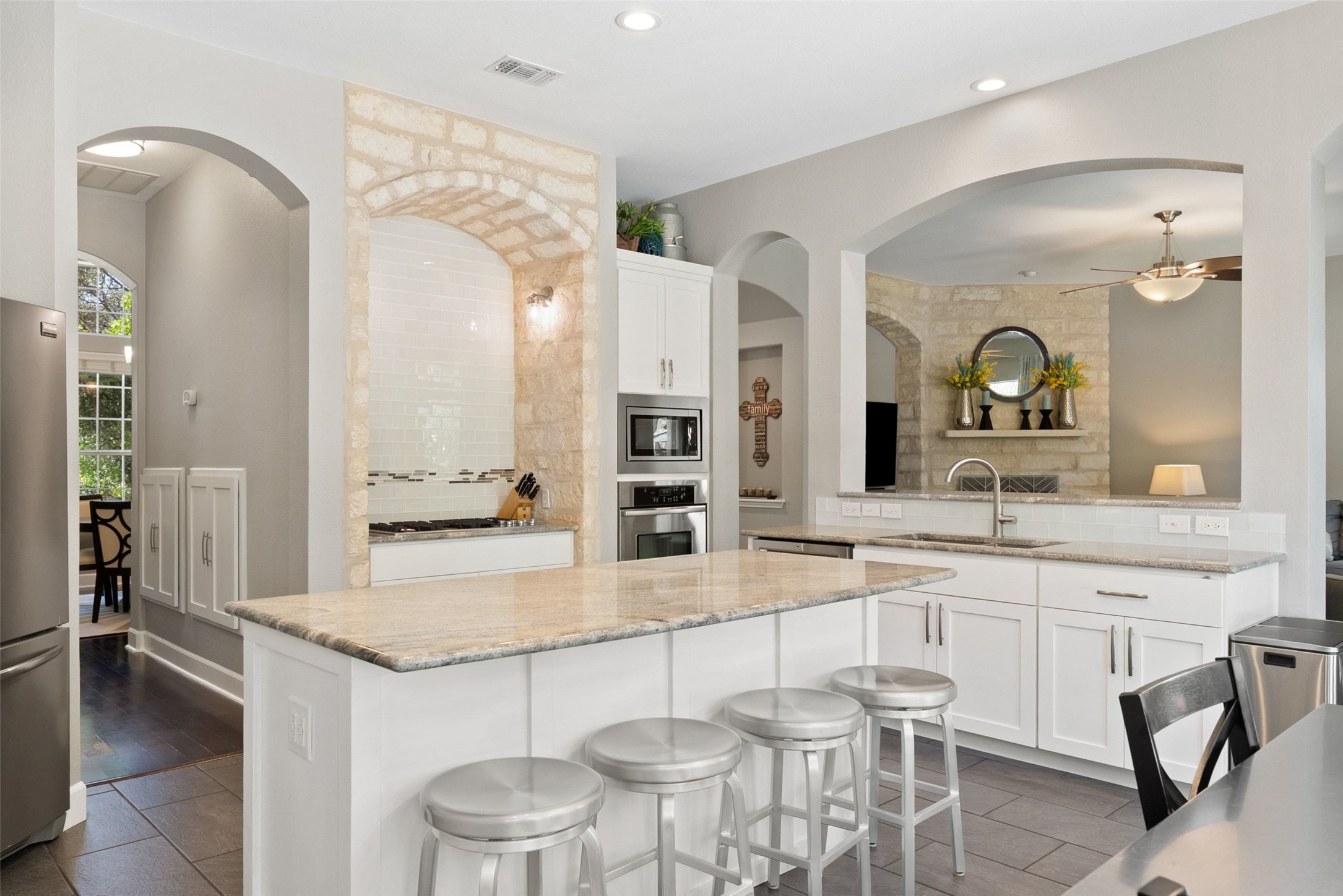 12510 Bright Sky Overlook Austin, TX 78732 - Photo 13 of 39 a kitchen with a table and chairs in it