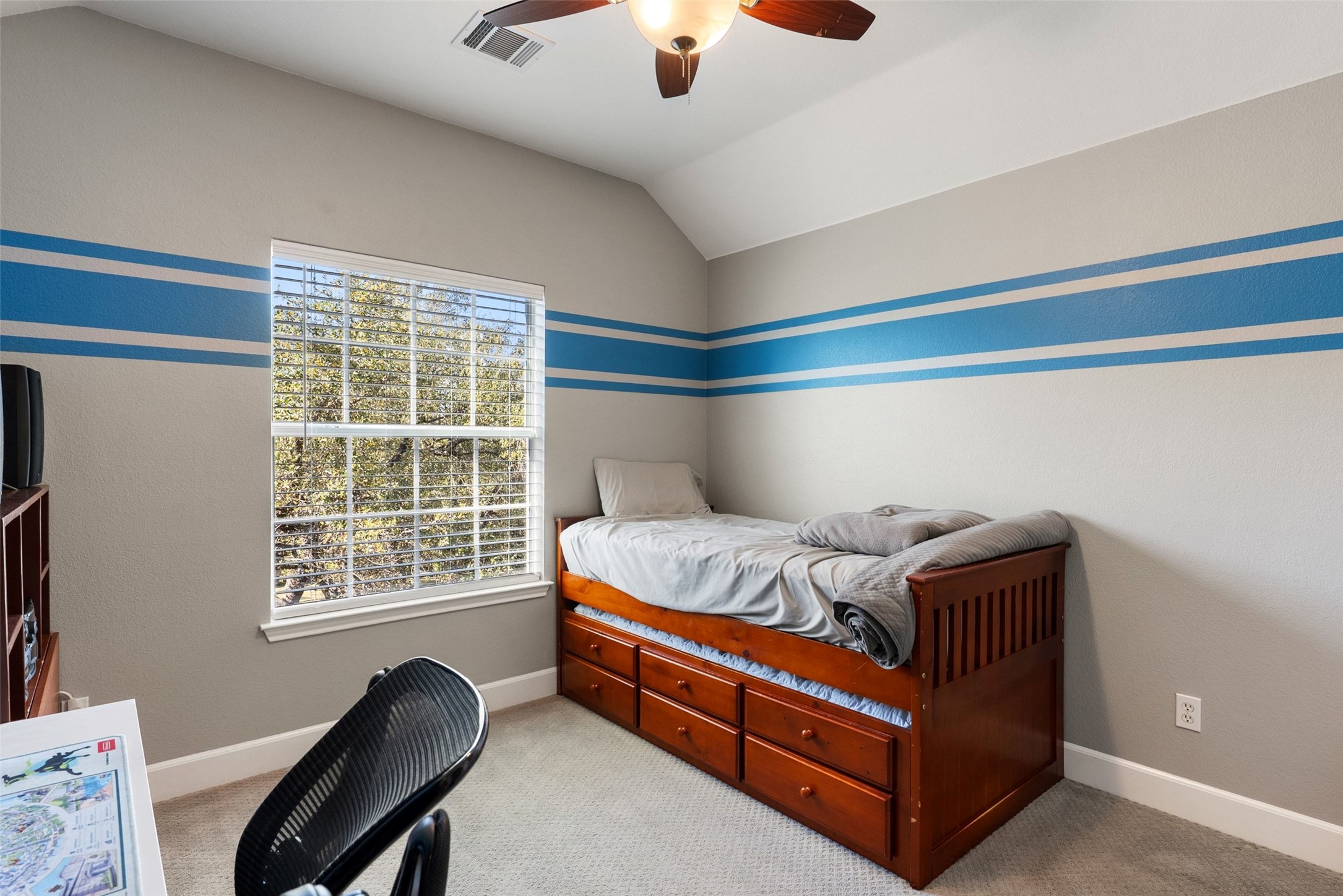 12510 Bright Sky Overlook Austin, TX 78732 - Photo 22 of 39 a bed sitting in a bedroom next to a window