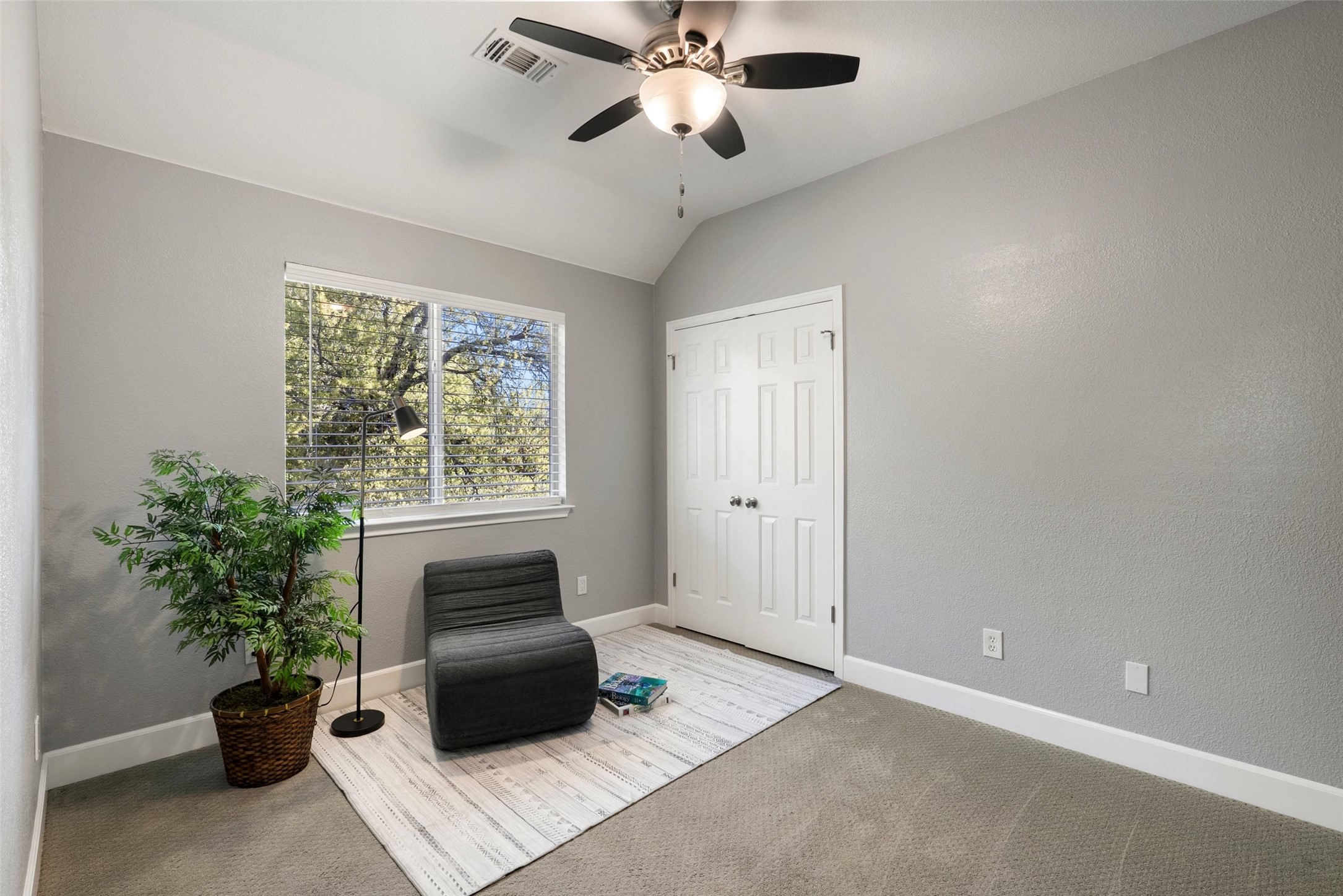 12510 Bright Sky Overlook Austin, TX 78732 - Photo 24 of 39 a living room with furniture and a potted plant