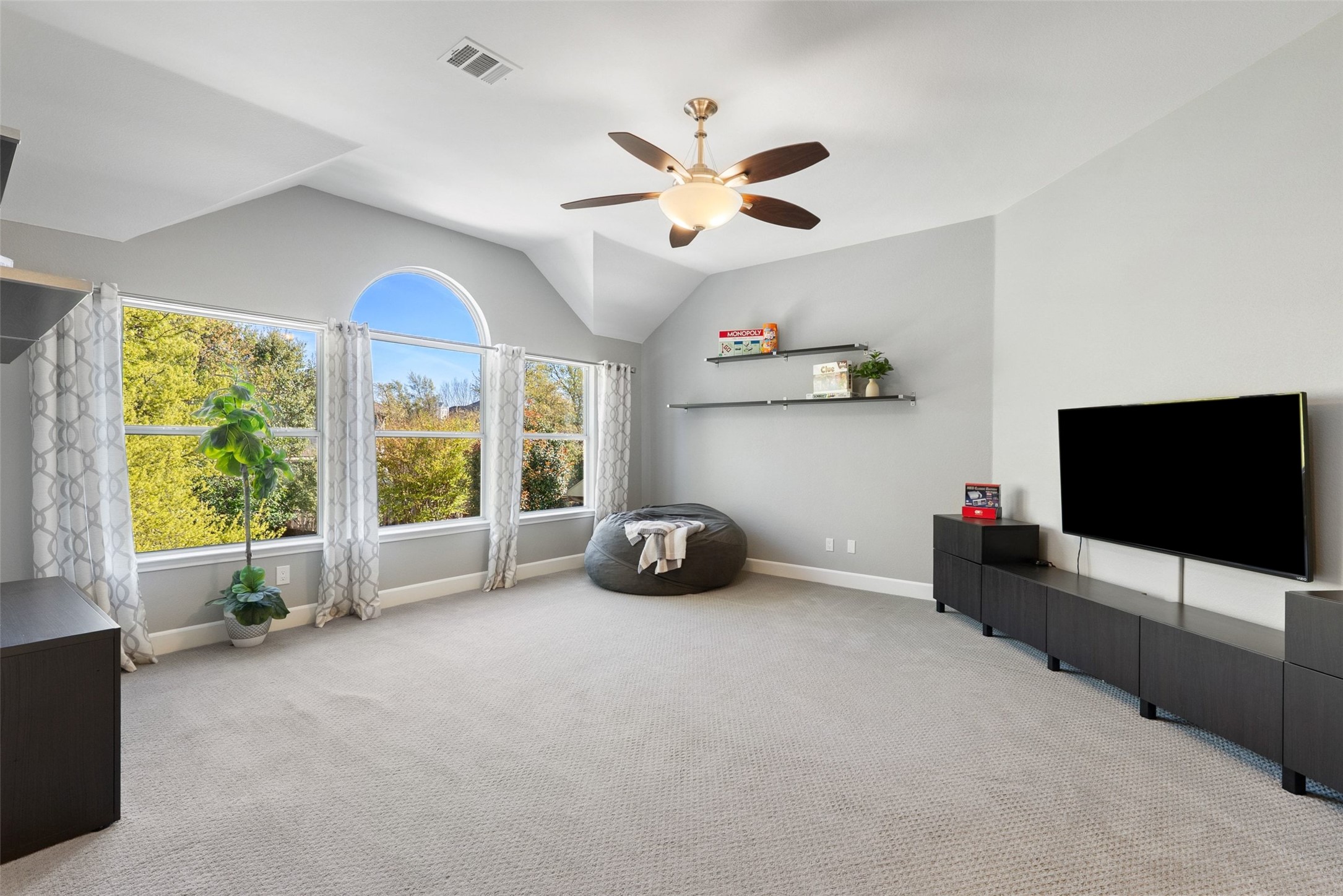 12510 Bright Sky Overlook Austin, TX 78732 - Photo 25 of 39 a living room with furniture and a flat screen tv