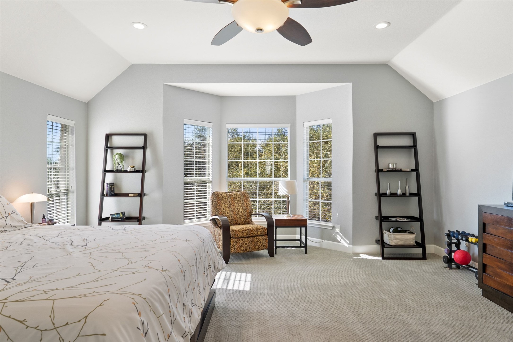 12510 Bright Sky Overlook Austin, TX 78732 - Photo 29 of 39 a spacious bedroom with a bed and a large window