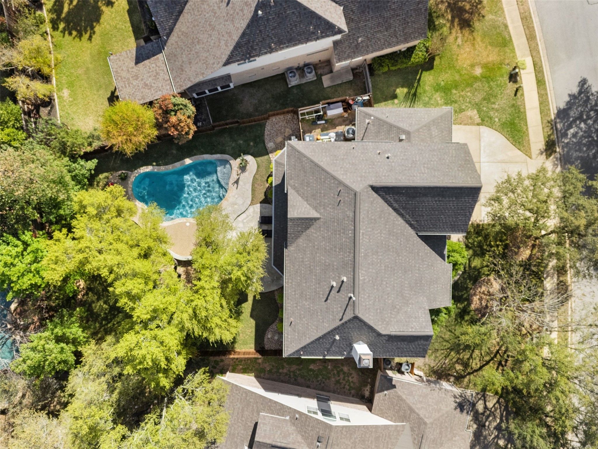 12510 Bright Sky Overlook Austin, TX 78732 - Photo 3 of 39 an aerial view of a house with a yard and large trees