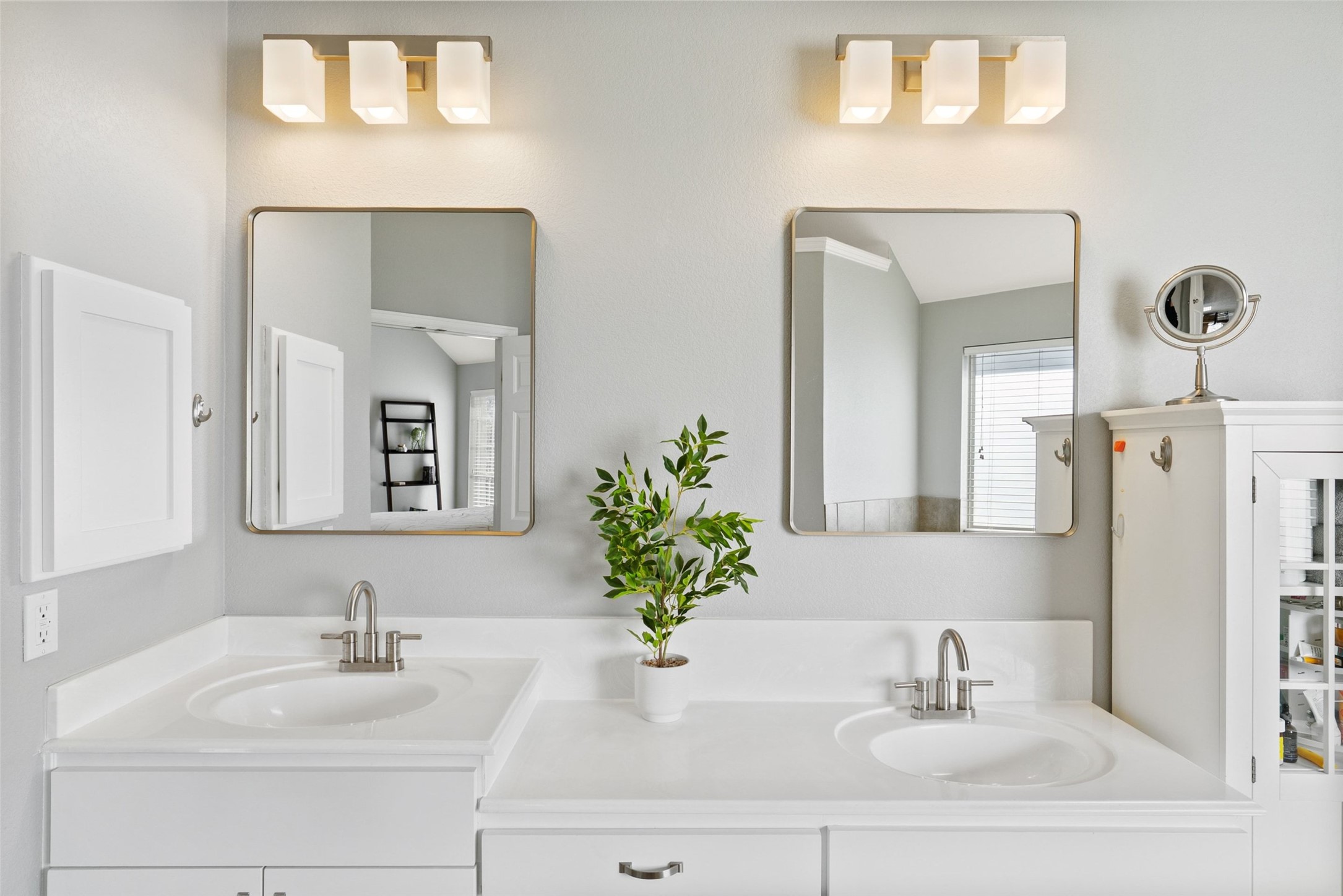 12510 Bright Sky Overlook Austin, TX 78732 - Photo 32 of 39 a bathroom with a sink a potted plant and a mirror