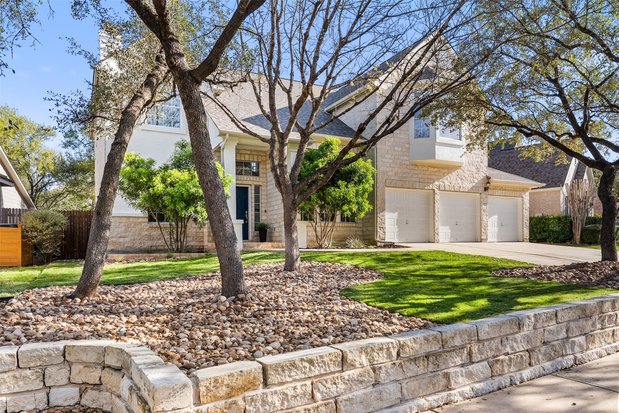 12510 Bright Sky Overlook Austin, TX 78732 - Photo 33 of 39 a front view of a house with a yard