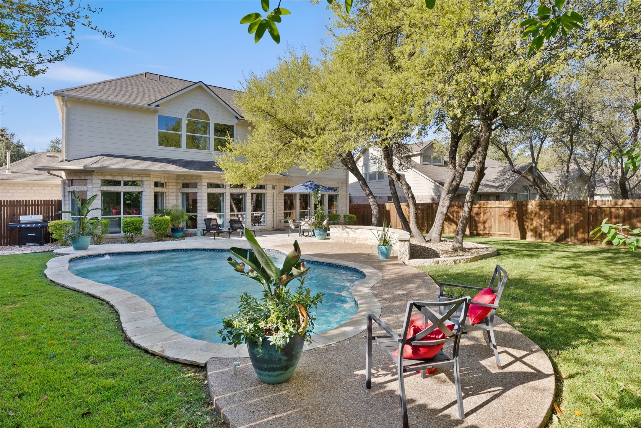 12510 Bright Sky Overlook Austin, TX 78732 - Photo 34 of 39 a view of a house with pool and sitting area