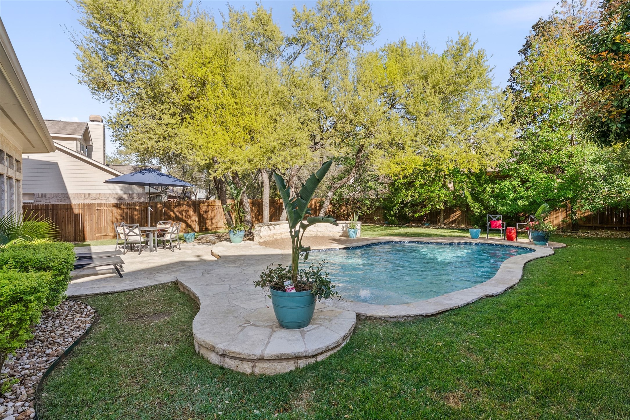 12510 Bright Sky Overlook Austin, TX 78732 - Photo 35 of 39 a view of a fountain in the front of a house