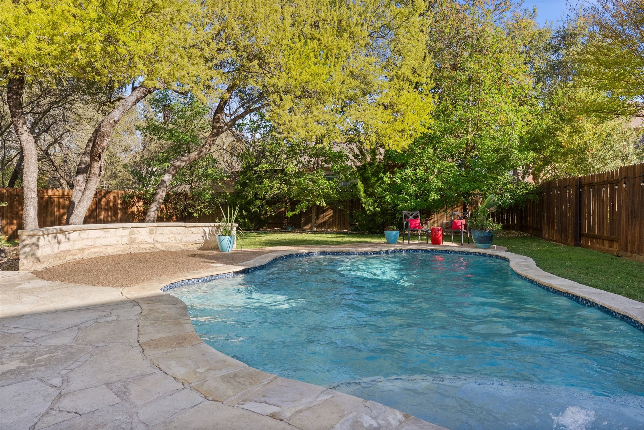 12510 Bright Sky Overlook Austin, TX 78732 - Photo 36 of 39 a view of a swimming pool with a yard