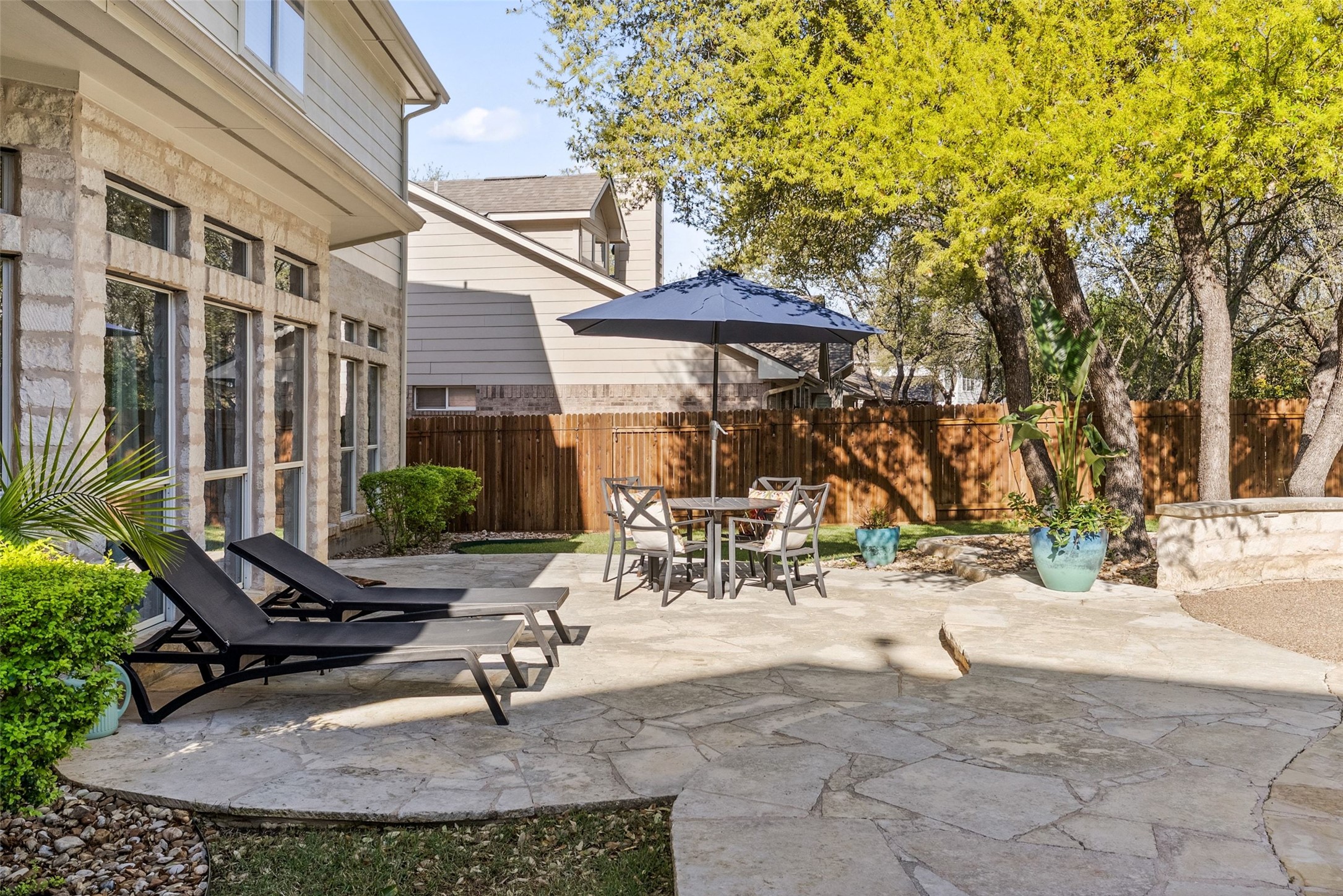 12510 Bright Sky Overlook Austin, TX 78732 - Photo 37 of 39 a view of a backyard with sitting area