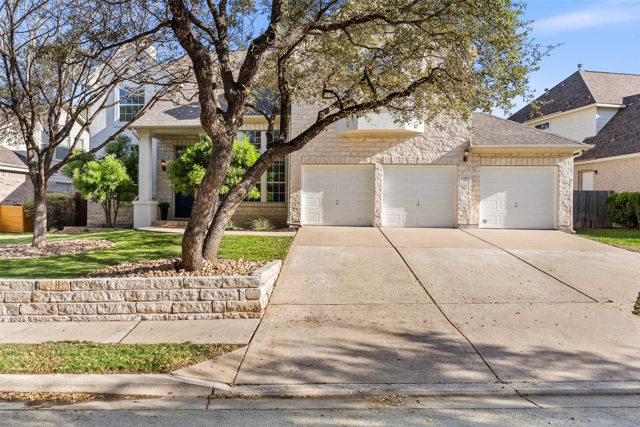 12510 Bright Sky Overlook Austin, TX 78732 - Photo 4 of 39 a front view of a house with a yard and potted plants