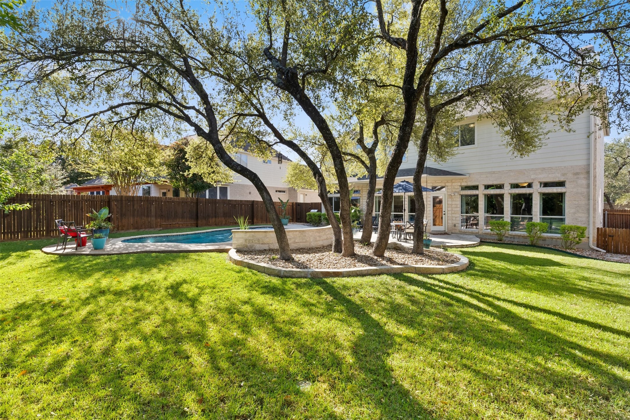 12510 Bright Sky Overlook Austin, TX 78732 - Photo 5 of 39 a view of a house with swimming pool and sitting area