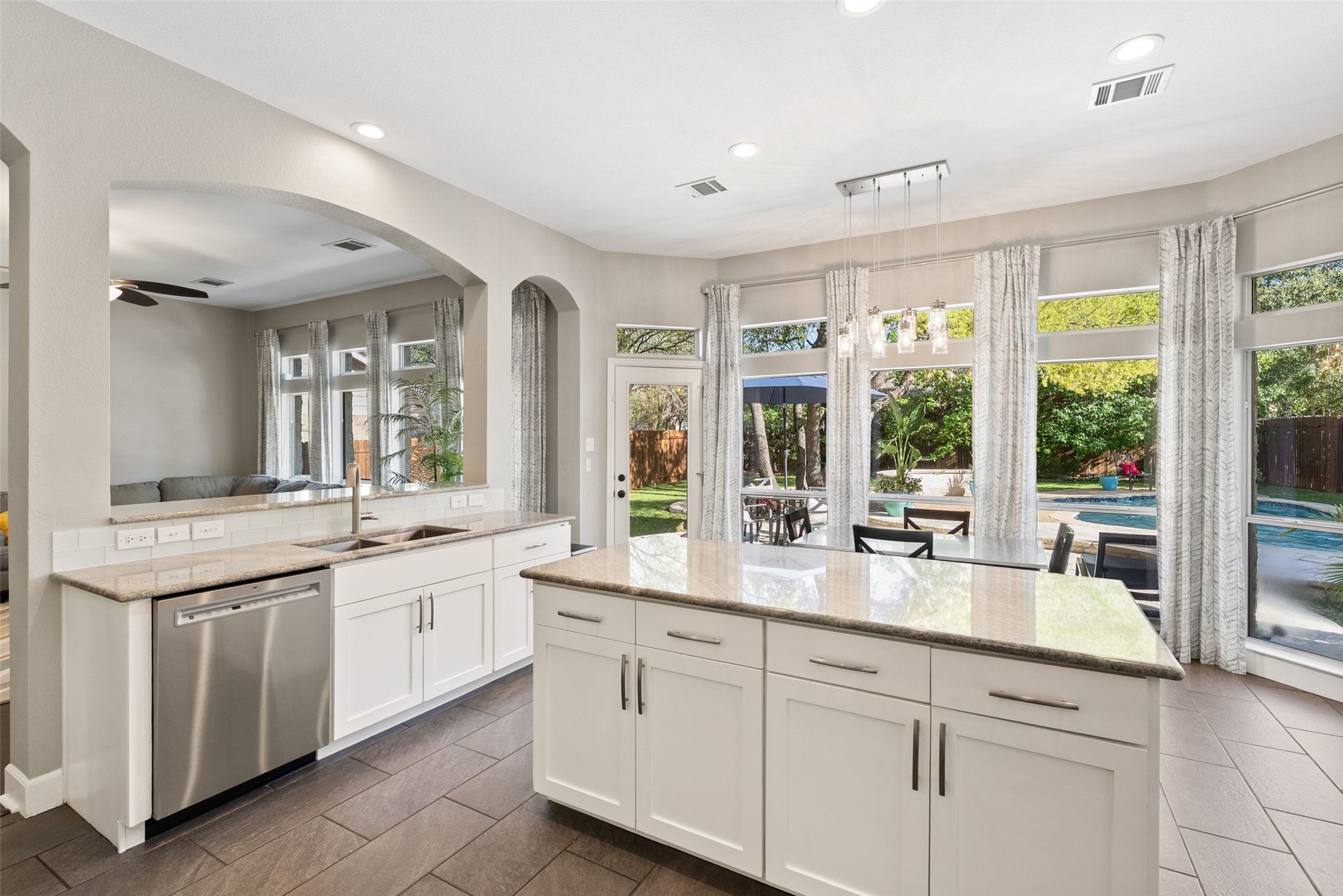 12510 Bright Sky Overlook Austin, TX 78732 - Photo 6 of 39 a large white kitchen with a large window