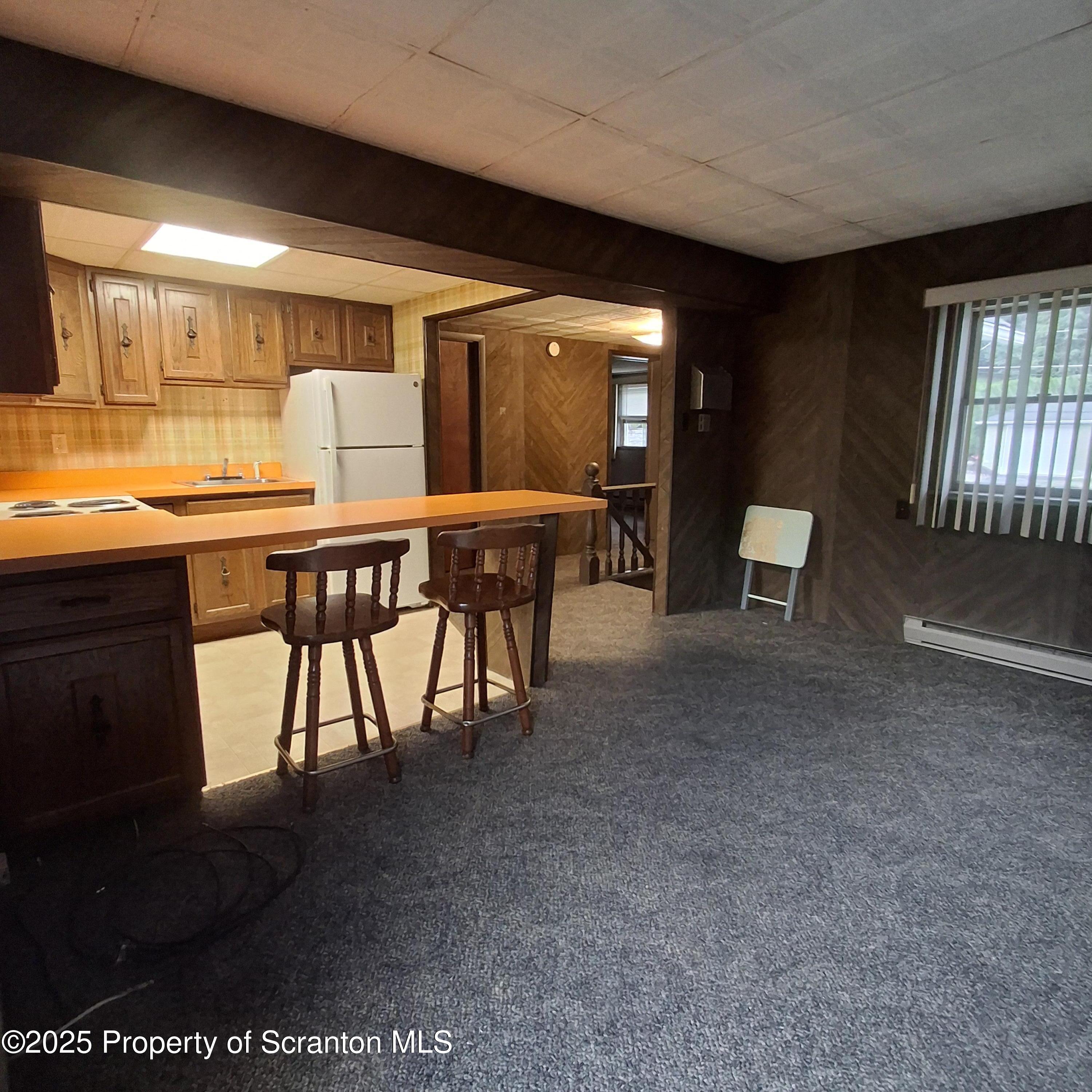 200 Poplar Street, Unit L 6 Archbald, PA 18403 - Photo 13 of 28 a view of a dining room with furniture and window