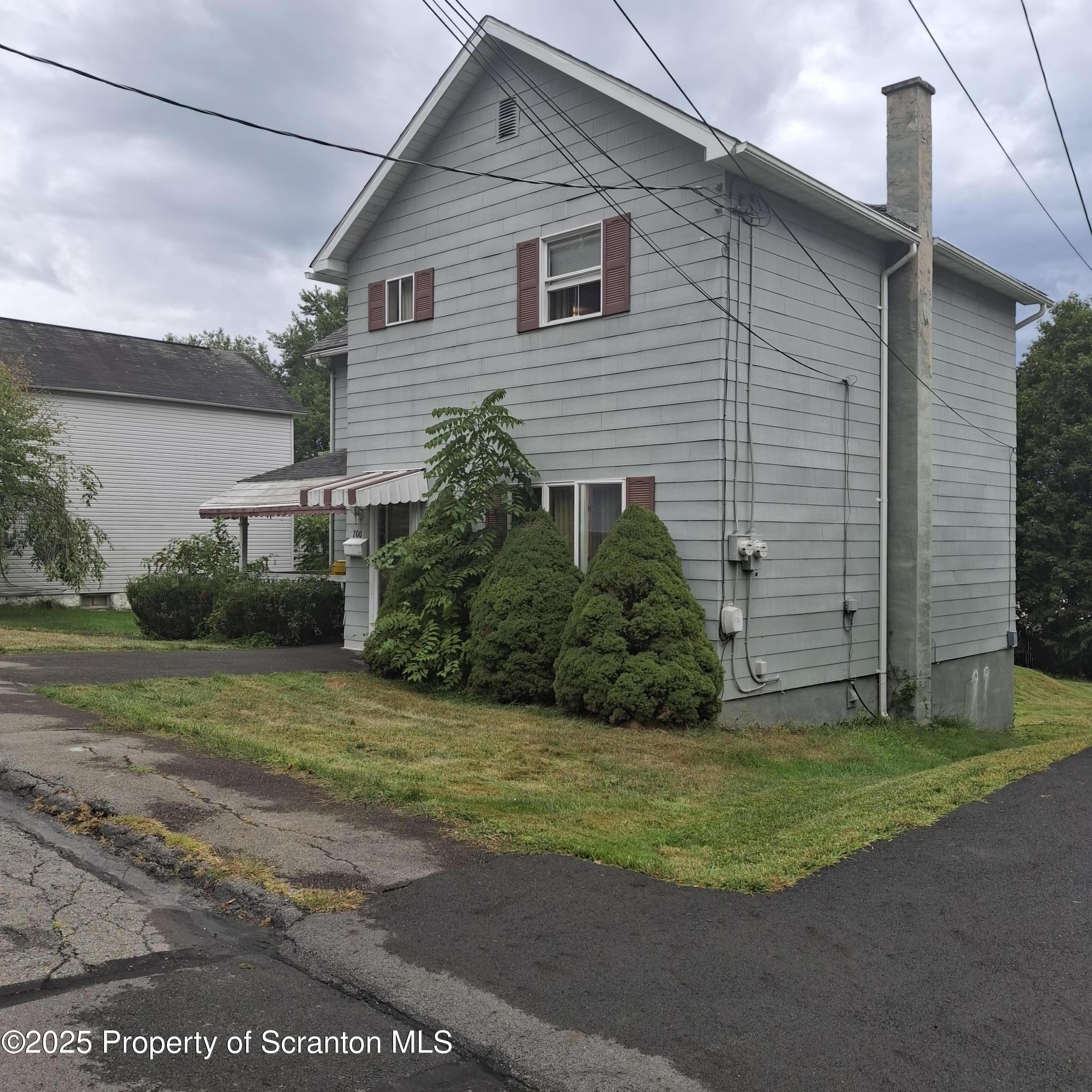 200 Poplar Street, Unit L 6 Archbald, PA 18403 - Photo 2 of 28 a view of a house with a yard