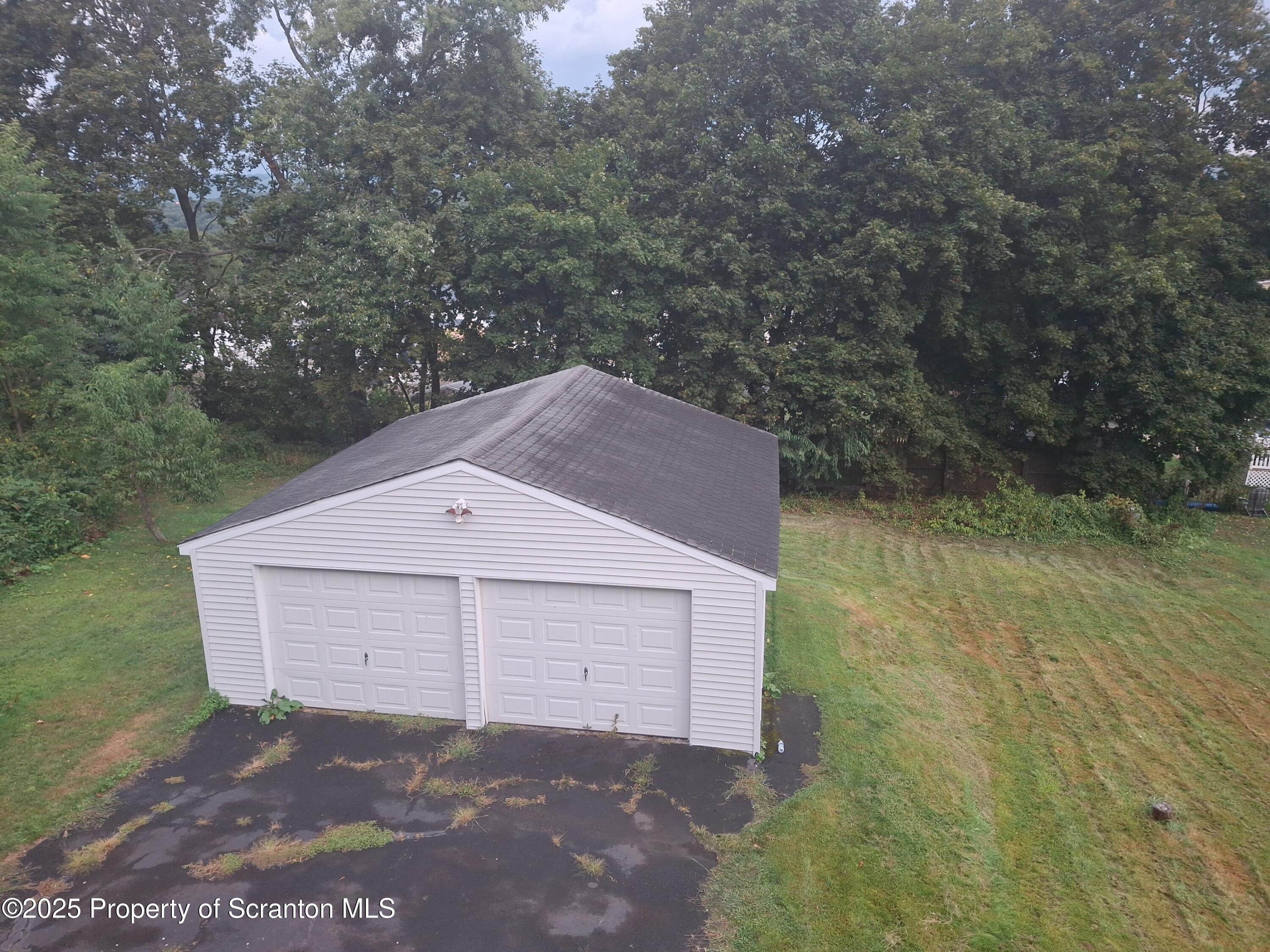 200 Poplar Street, Unit L 6 Archbald, PA 18403 - Photo 23 of 28 a view of a house with a yard and large tree