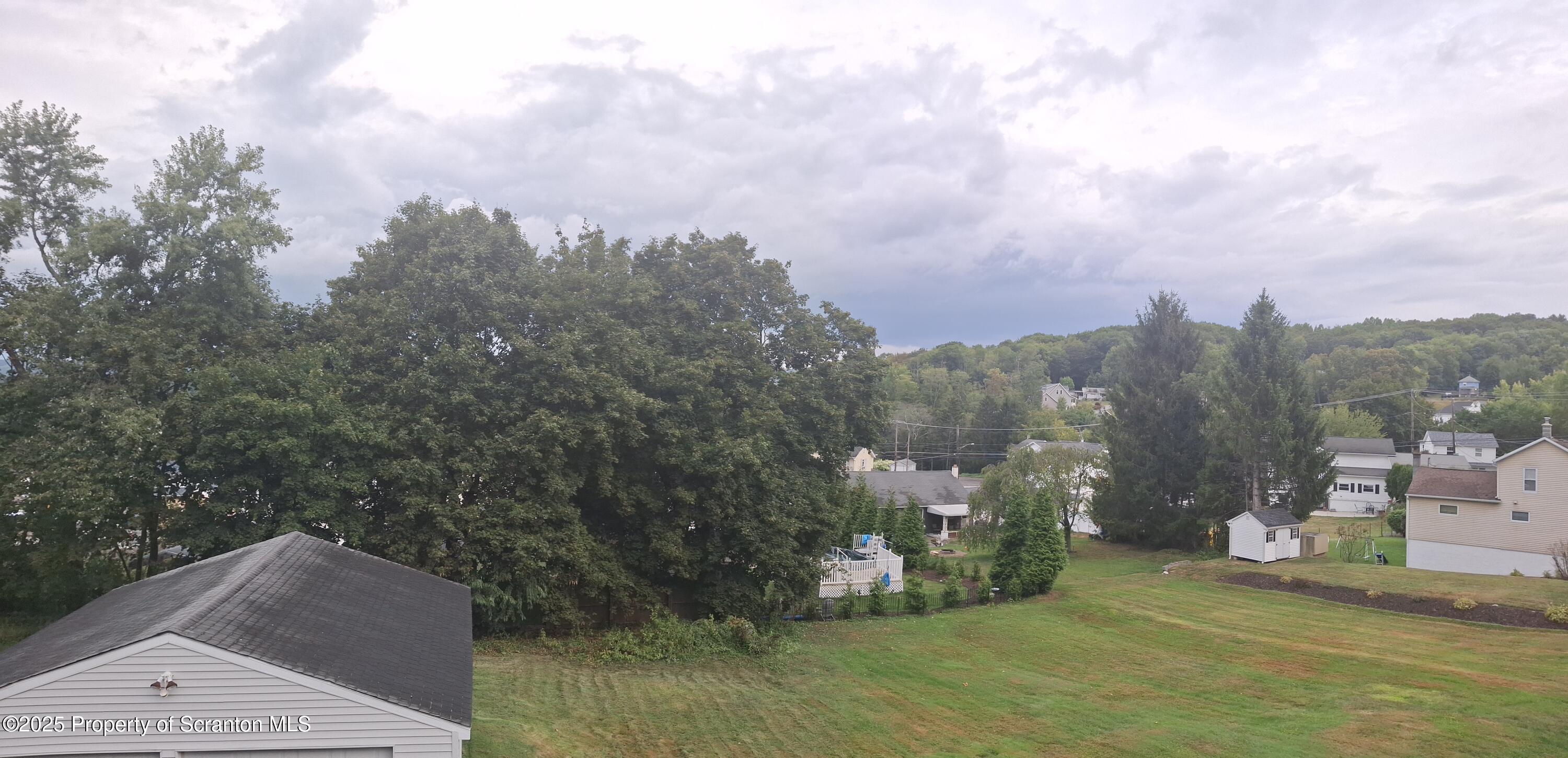 200 Poplar Street, Unit L 6 Archbald, PA 18403 - Photo 25 of 28 a view of a town with mountains in the background