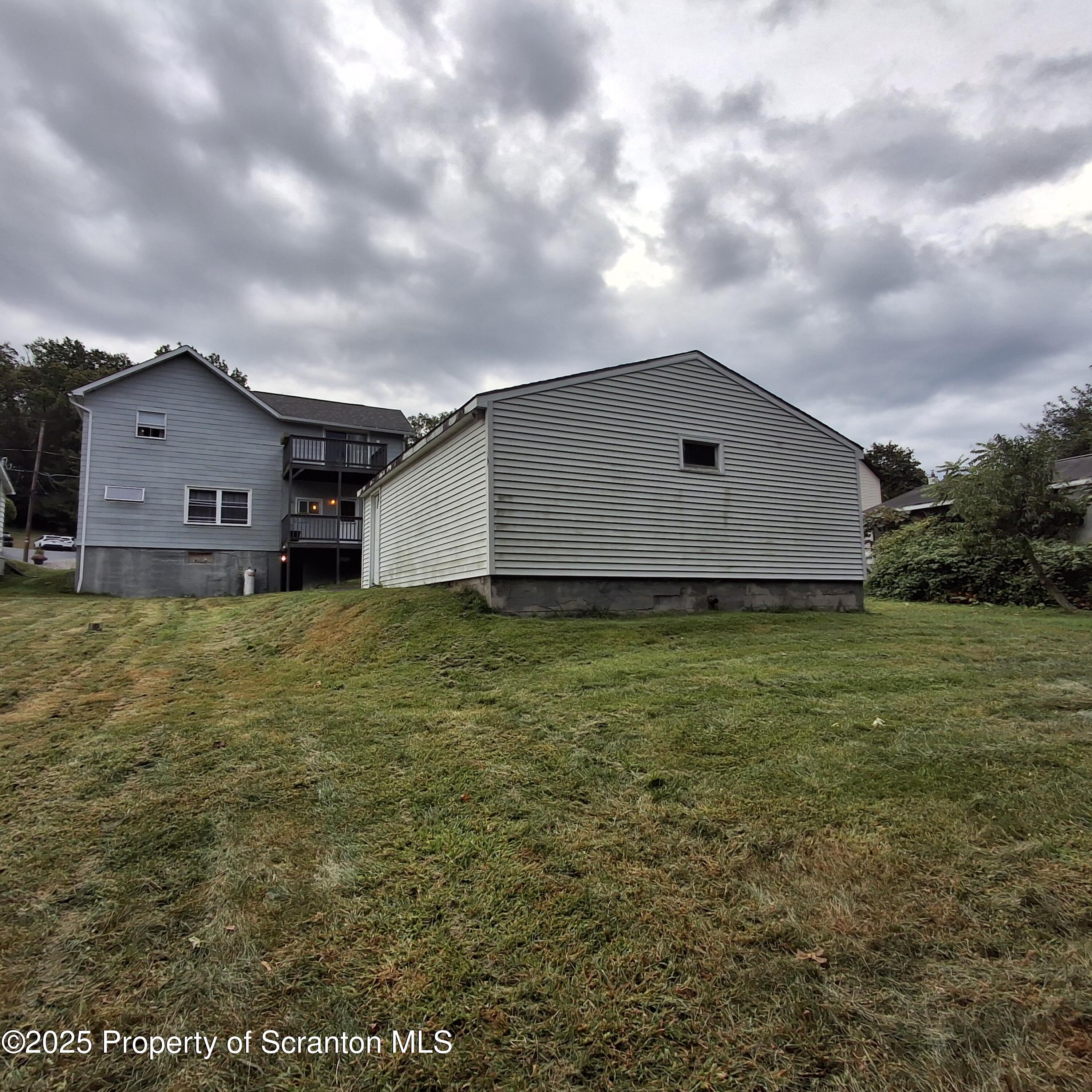 200 Poplar Street, Unit L 6 Archbald, PA 18403 - Photo 26 of 28 a house view with a garden space
