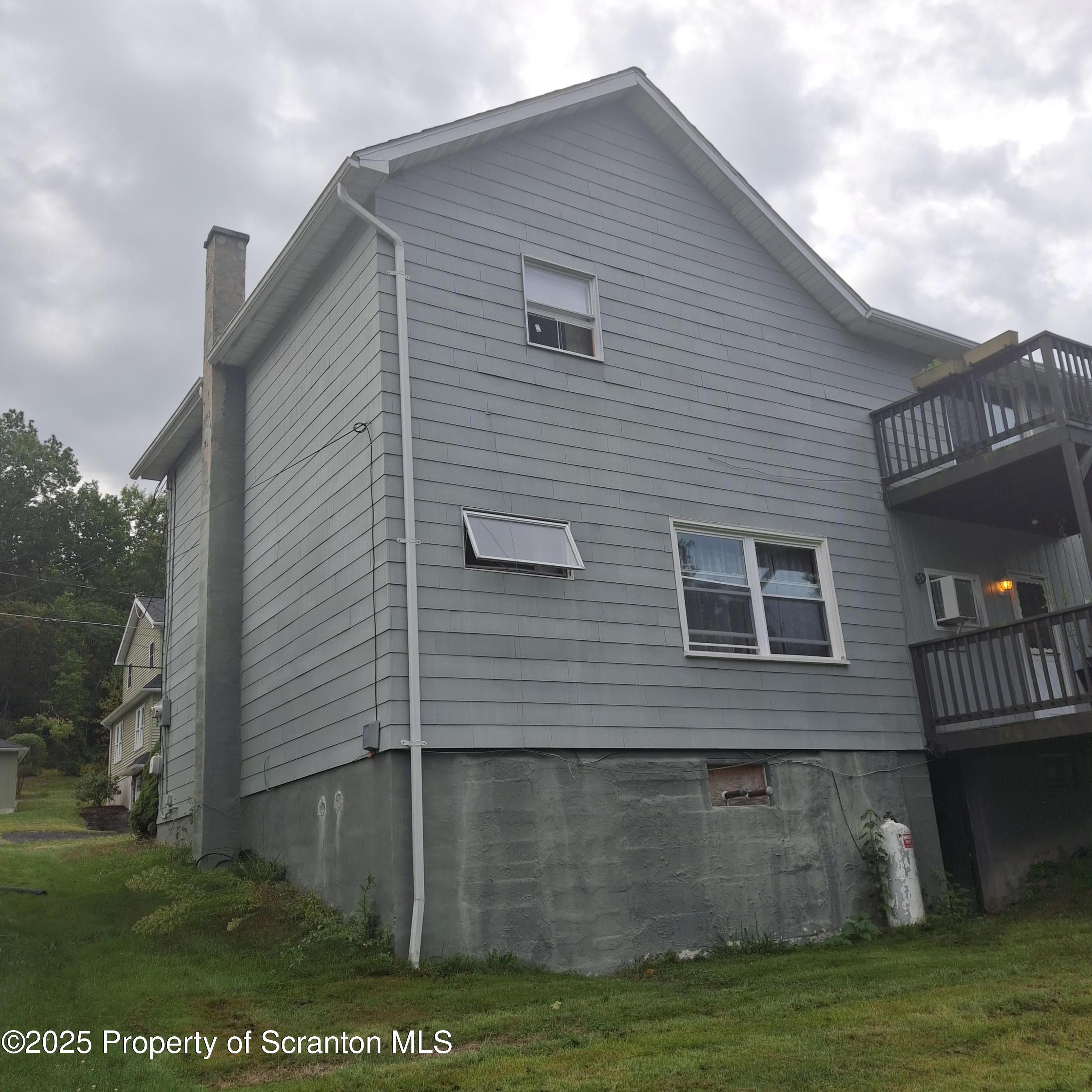 200 Poplar Street, Unit L 6 Archbald, PA 18403 - Photo 27 of 28 a view of a house with a yard