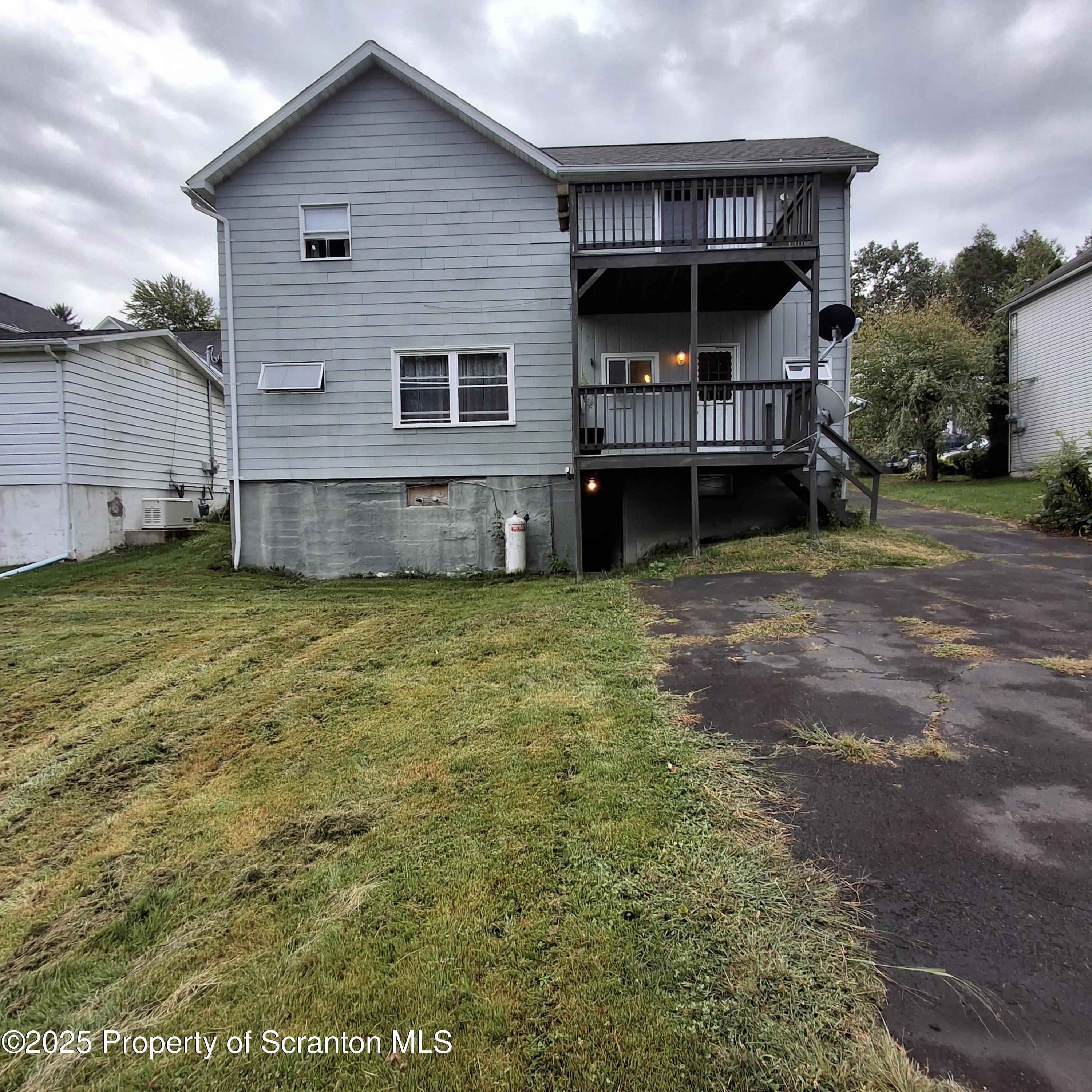 200 Poplar Street, Unit L 6 Archbald, PA 18403 - Photo 28 of 28 a view of a house with a yard