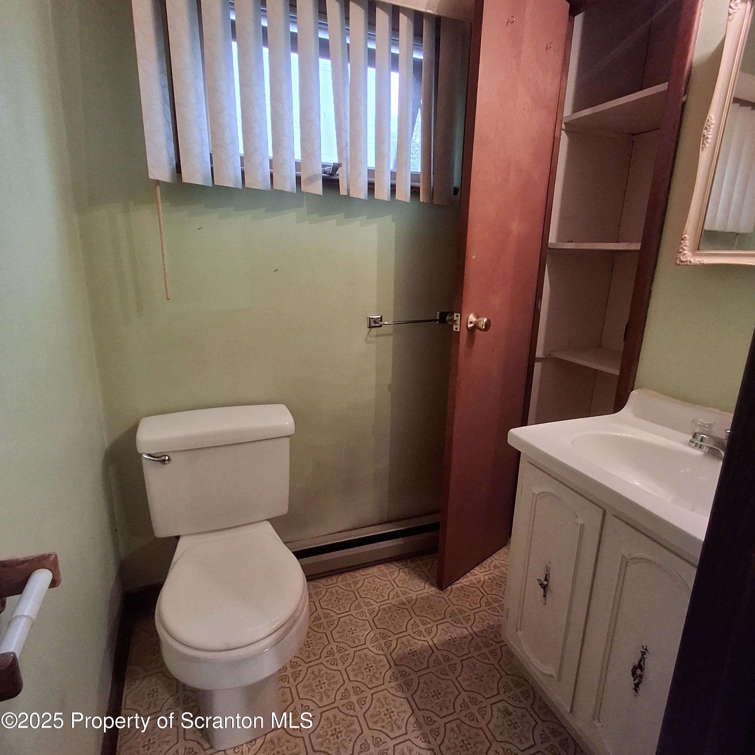200 Poplar Street, Unit L 6 Archbald, PA 18403 - Photo 4 of 28 a bathroom with a toilet and a shower