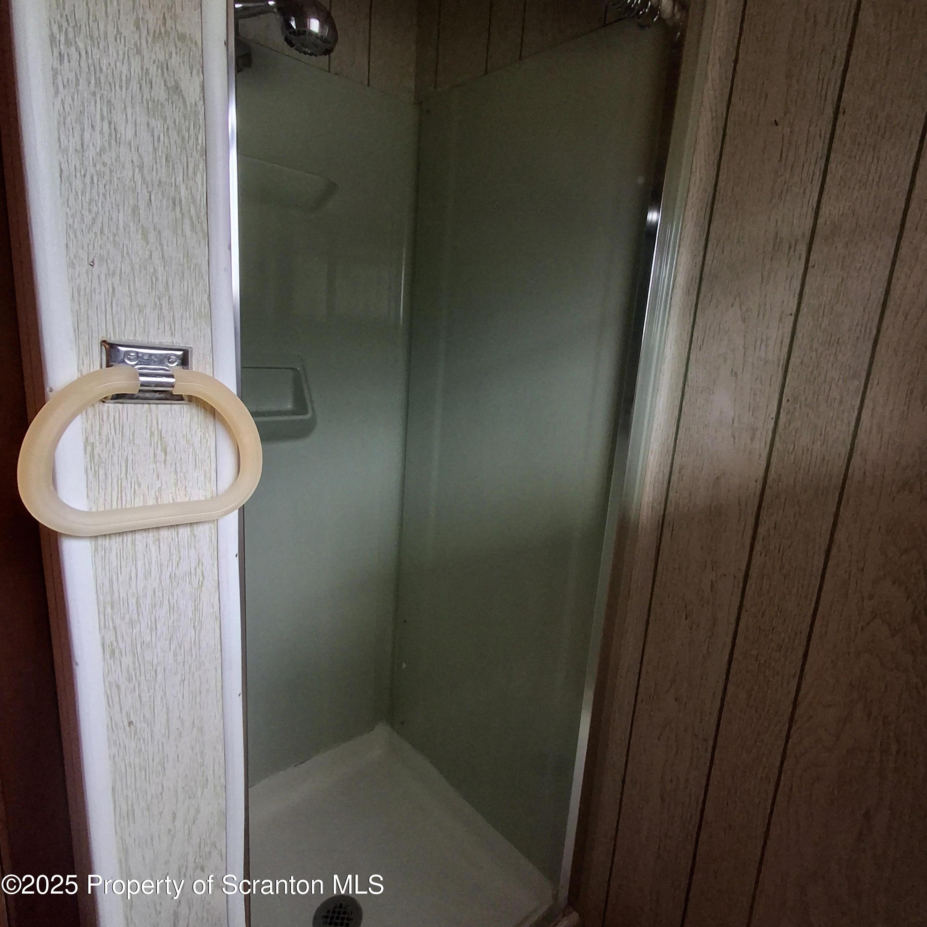 200 Poplar Street, Unit L 6 Archbald, PA 18403 - Photo 5 of 28 a bathroom with a sink and a mirror