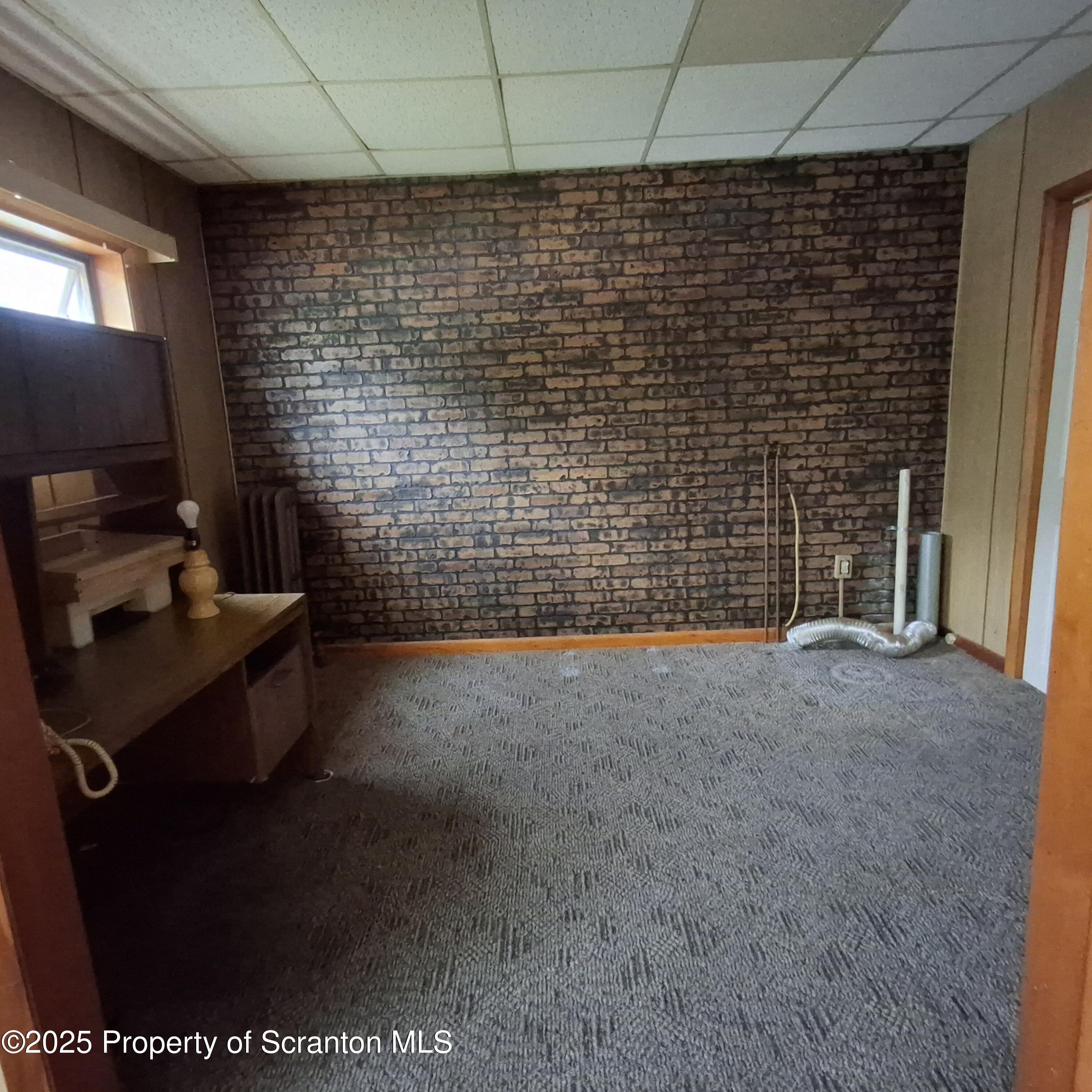 200 Poplar Street, Unit L 6 Archbald, PA 18403 - Photo 8 of 28 a bathroom with a sink a toilet and a shower
