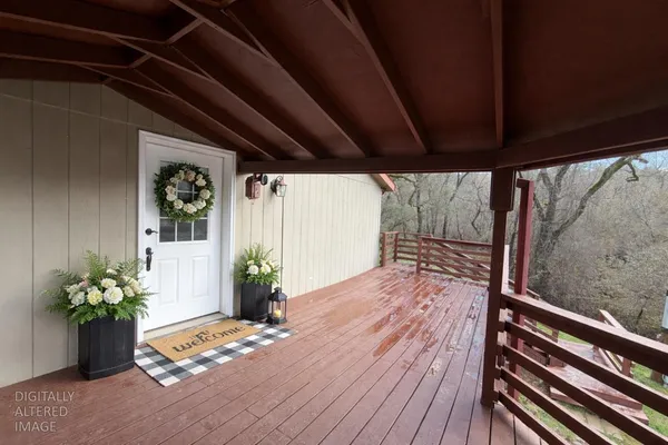 a view of porch with wooden floor