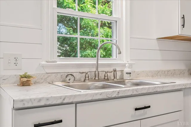 a kitchen with a sink and a window
