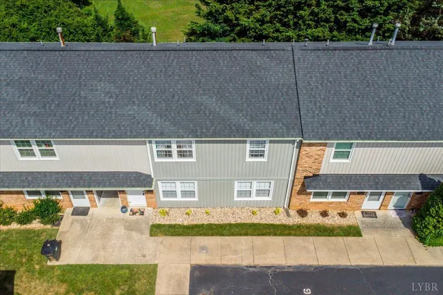 an aerial view of a house with outdoor space